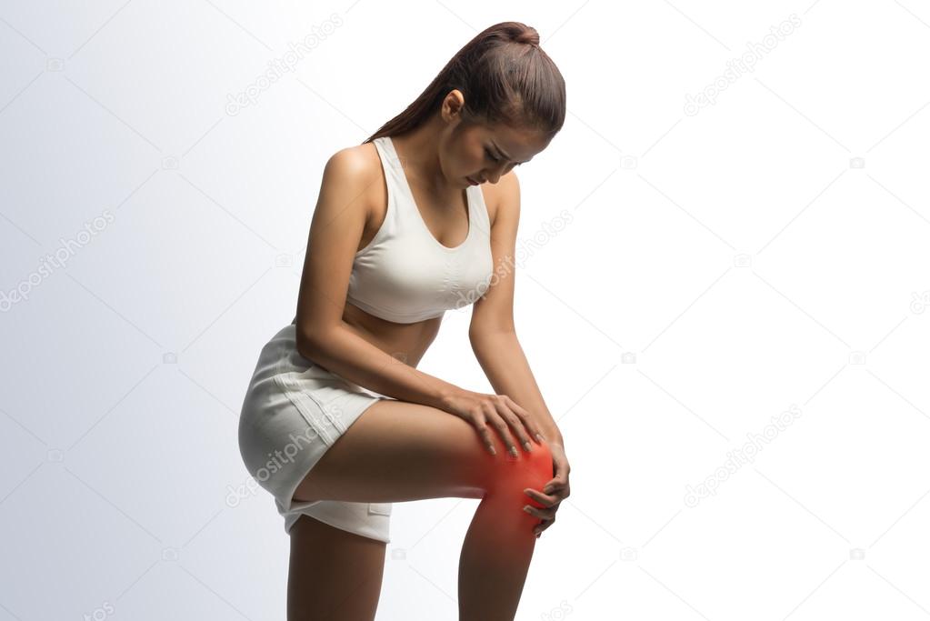 Woman having knee pain on a white background with clipping path