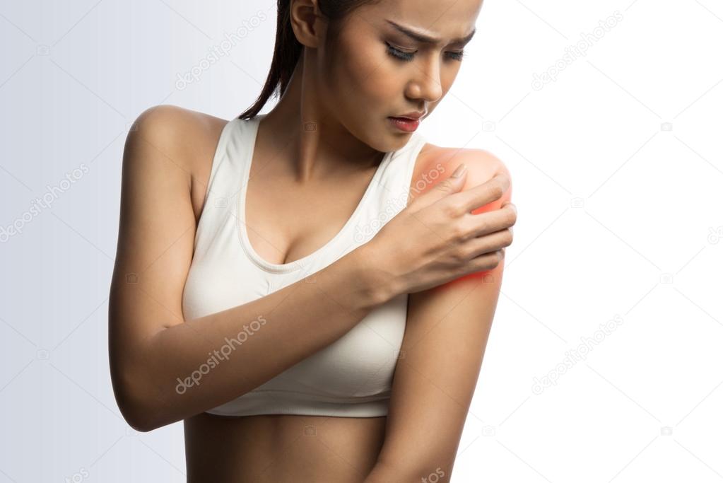 young muscular woman with shoulder pain, on white background with clipping path