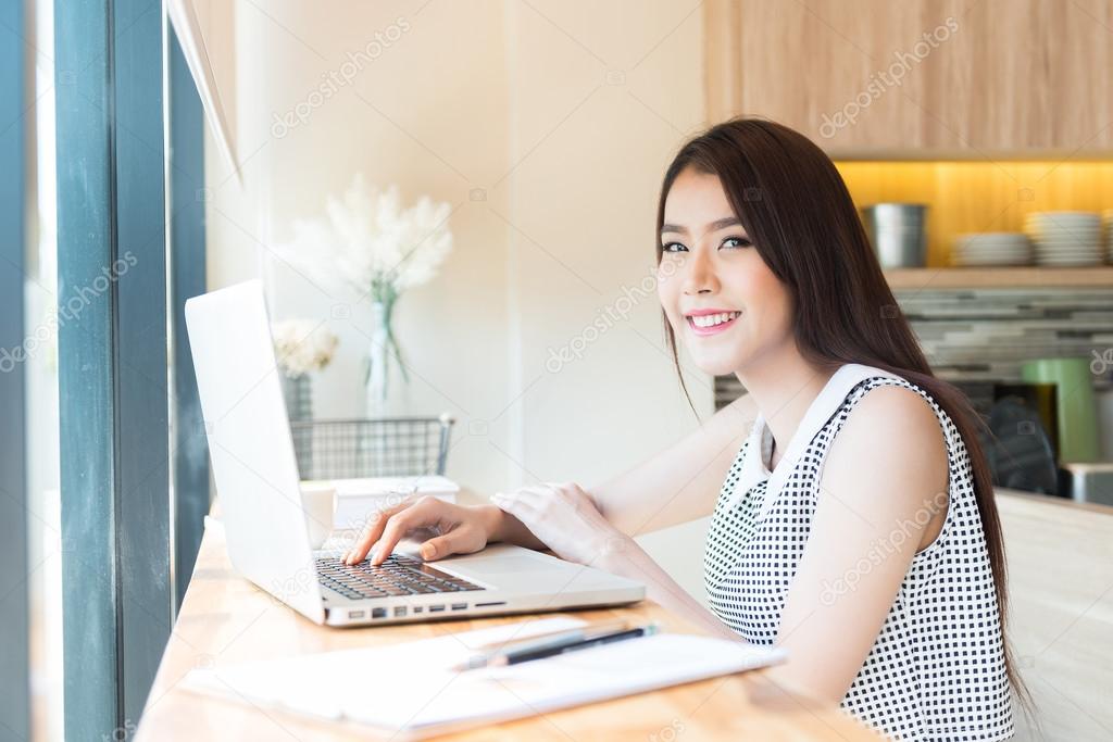 Beautiful business woman using a laptop computer