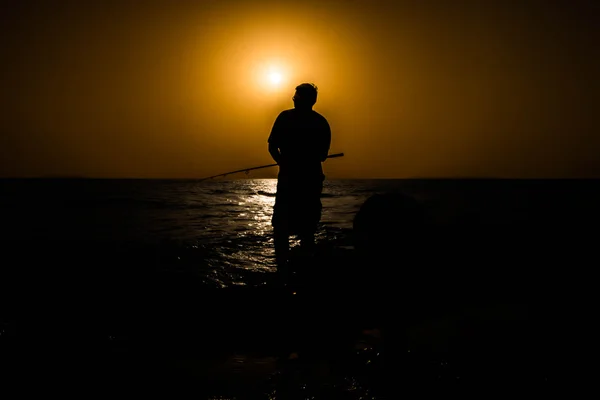 Fisherman at sunset — Stock Photo, Image