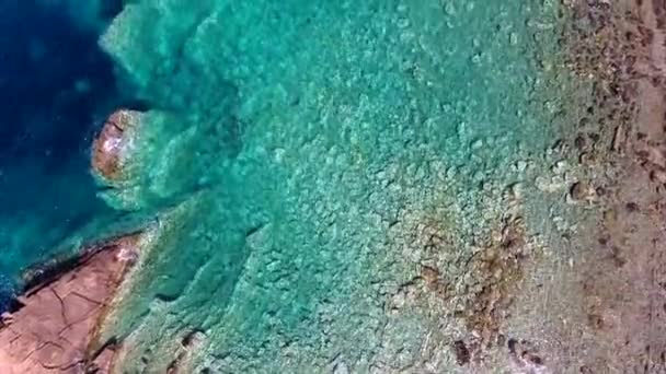 Clear Shallow Sea Water Cove Surrounded Stone Rocky Coastline Aerial — Stock Video