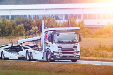 Utility truck parked near dirt construction site