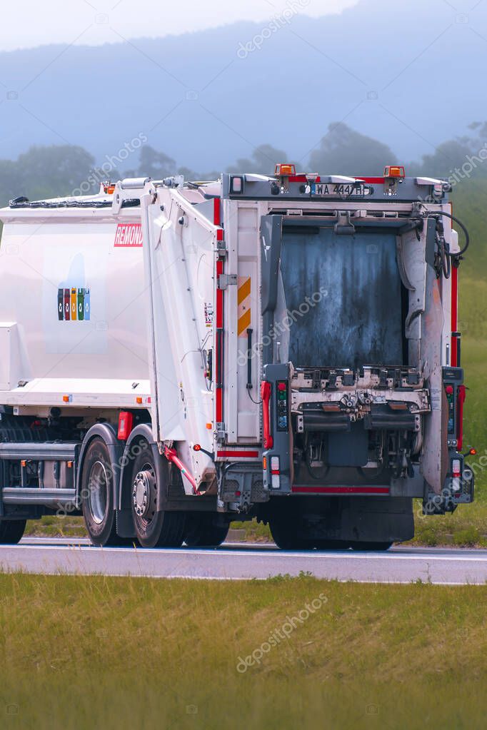 Remondis brand garbage truck traveling on asphalt road 12.08.2025 Poland Europe