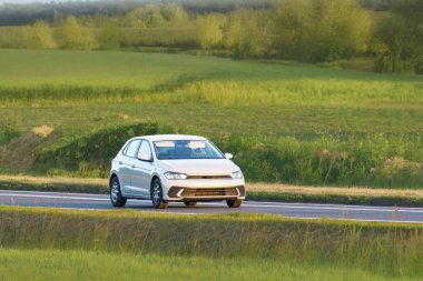 Front view of hatchback on summer drive