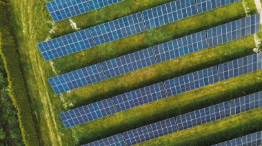 Drone view of solar farm at sunset Solar panels producing power