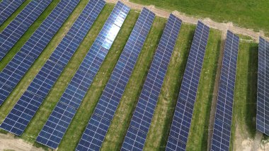 Drone view of solar farm at sunset Solar panels producing power