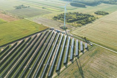 Solar panels installation near wind power turbine