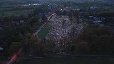 Cemetery illuminated with candles on holy night