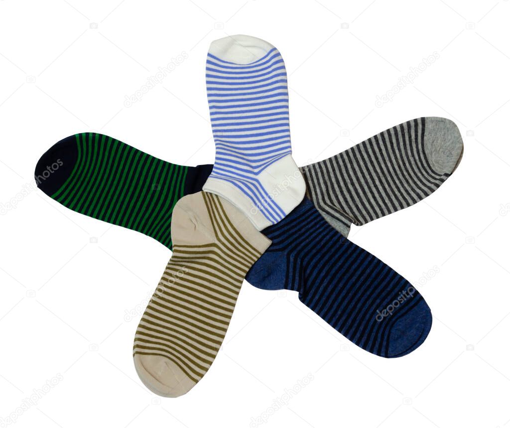 striped socks in different colors stacked in the form of a star on a white background