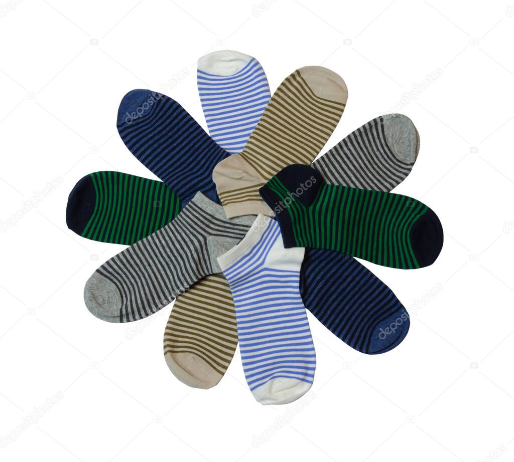 striped socks of different colors folded in the form of flower petals on a white background