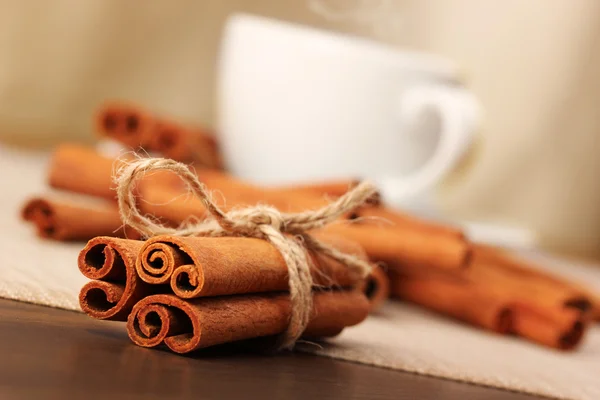 Cinnamon and beverage cup on wooden table series - 6 — Stock Photo, Image