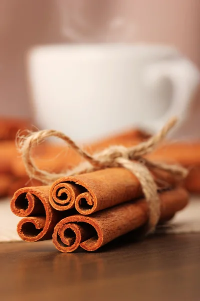 Cinnamon and beverage cup on wooden table series - 5 — Stock Photo, Image