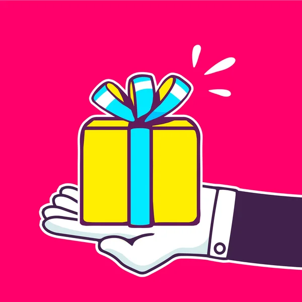 Mano celebración caja de regalo amarillo — Vector de stock