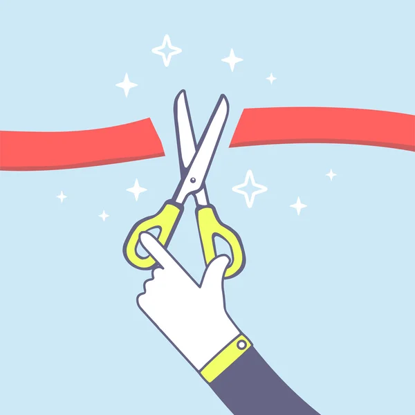 hand holding scissors with red ribbon