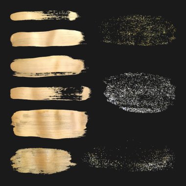 Yarım tonlu altın parıltı lekeleri. Siyah arkaplanda altın parıldayan vektör fırça darbeleri.