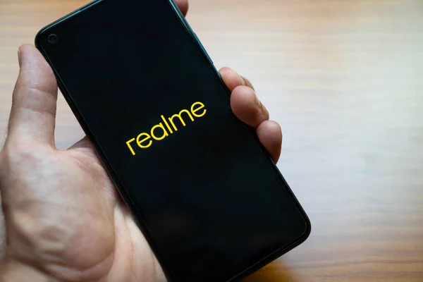 Hand Person Holding New Smartphone Realme While Turning Presentation New — Stock Photo, Image