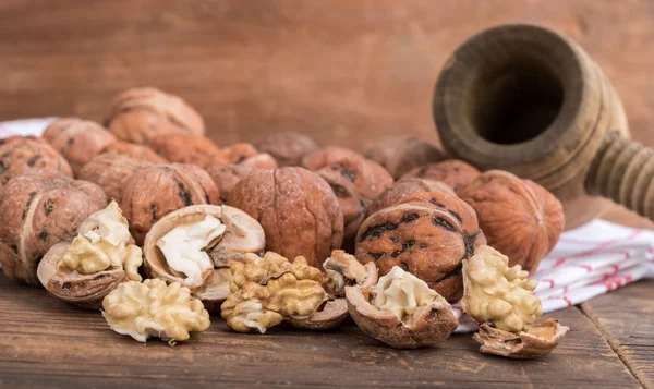 Fresh walnuts with nutcracker — Stock Photo, Image