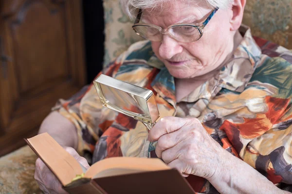 Old woman reading a book