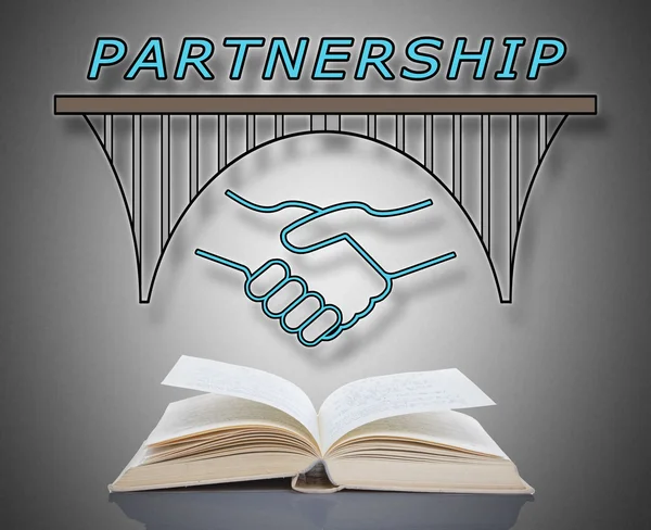 Partnerschap concept boven een boek — Stockfoto