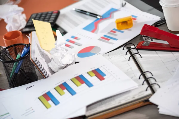 Messy and cluttered office desk