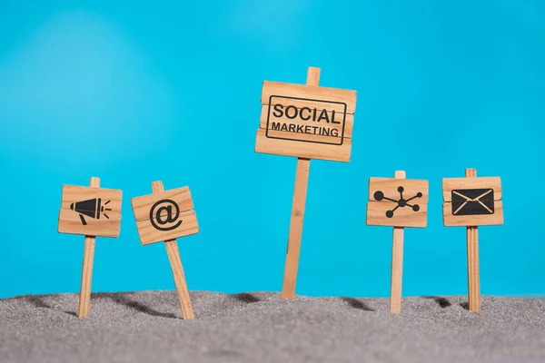 Concept of social marketing with icons on wooden signs