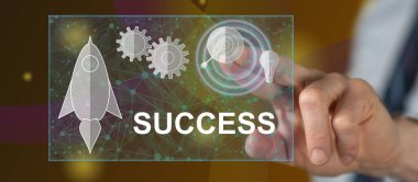 Bir adam dokunmatik ekranda iş başarısı kavramına parmağıyla dokunuyor.