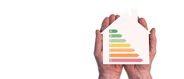 Manos Sosteniendo Una Casa Que Muestra Eficiencia Energética Del Hogar —  Fotos de Stock