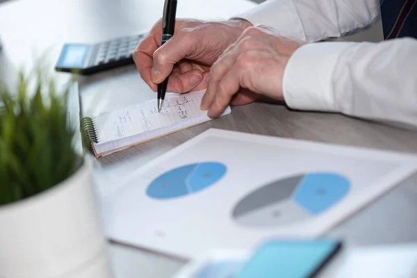 Businessman Analyzing Marketing Data Taking Notes — Stock Photo, Image