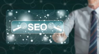 Bir adam dokunmatik ekranda bir konsepte parmağıyla dokunuyor.