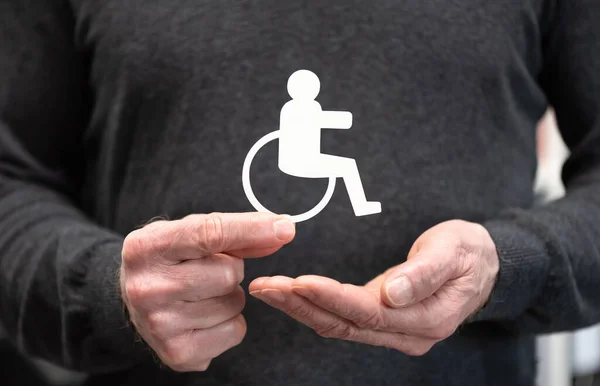 Muž Držící Zdravotně Postiženou Osobu Pojem Pojištění Pro Případ Invalidity — Stock fotografie