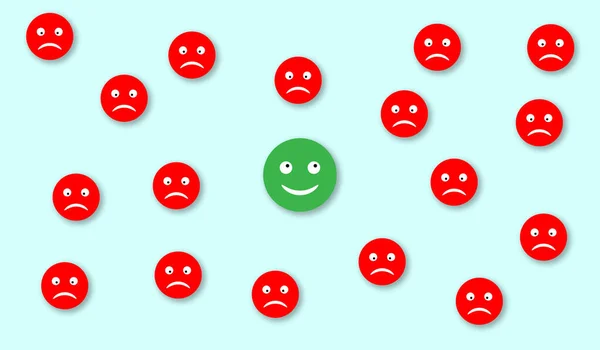 Happy green face arrounded with sad red faces. Concept of optimism and satisfaction
