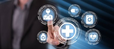 Adam dokunmatik ekranda sağlık sigortasına dokunuyor.