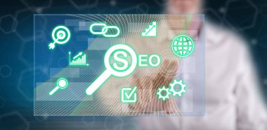 Bir adam dokunmatik ekranda bir konsepte parmağıyla dokunuyor.