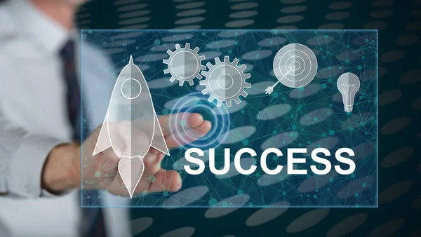 Bir adam dokunmatik ekranda iş başarısı kavramına parmağıyla dokunuyor.