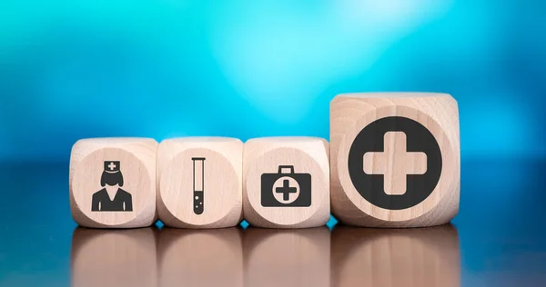 Wooden blocks with symbol of healthcare concept on blue background