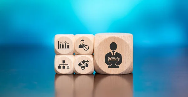 Wooden blocks with symbol of job loss concept on blue background