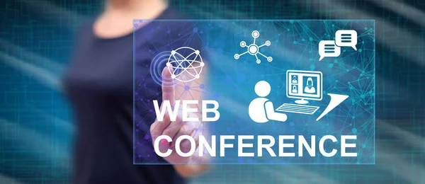 Woman touching a web conference concept on a touch screen with her finger