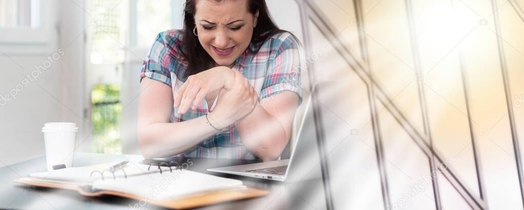 Young businesswoman suffering from wrist pain; multiple exposure