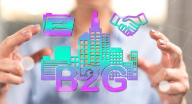 Arka planda bir kadının elleri arasındaki B2G kavramı