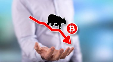 Bitcoin ayı eğilimi kavramı arka plandaki adamın elinin üstünde