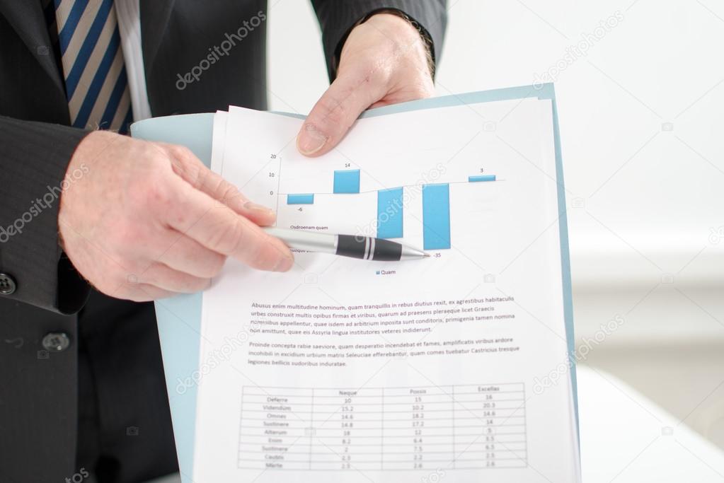 Businessman showing graphs