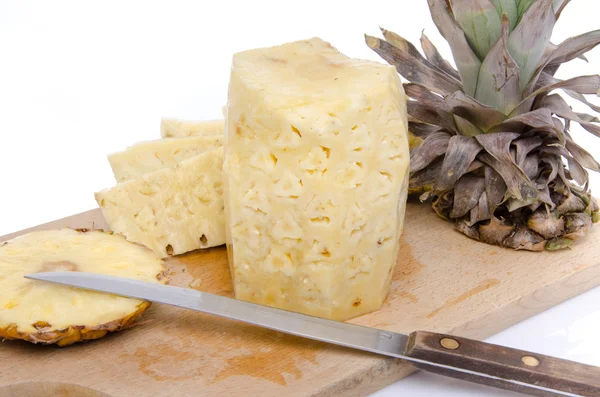 Peeled pineapple on a wooden board — Stock Photo, Image