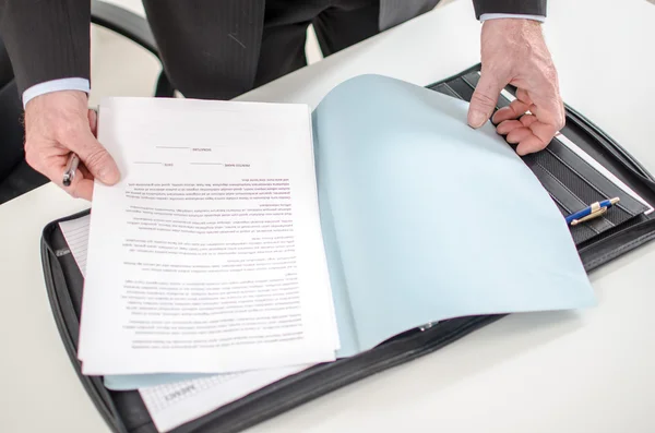 Businessman looking at a document — Stock Photo, Image