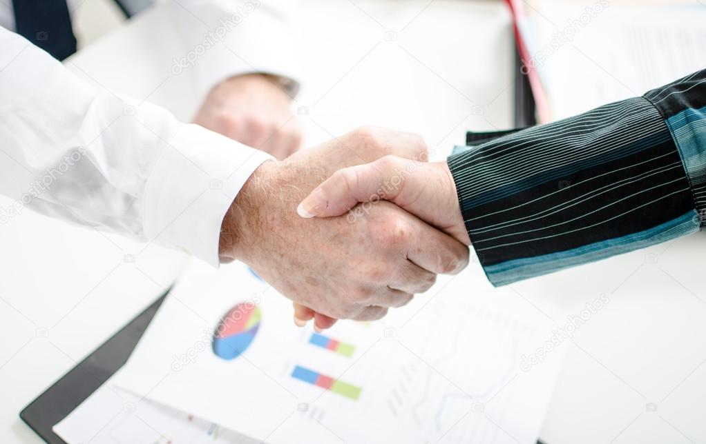 Business associates shaking hands