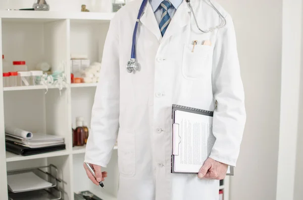 Doctor standing in his office — Stock Photo, Image