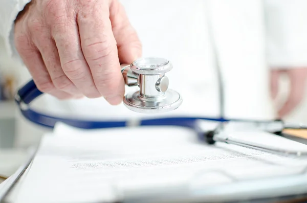 Doctor holding a stethoscope — Stock Photo, Image