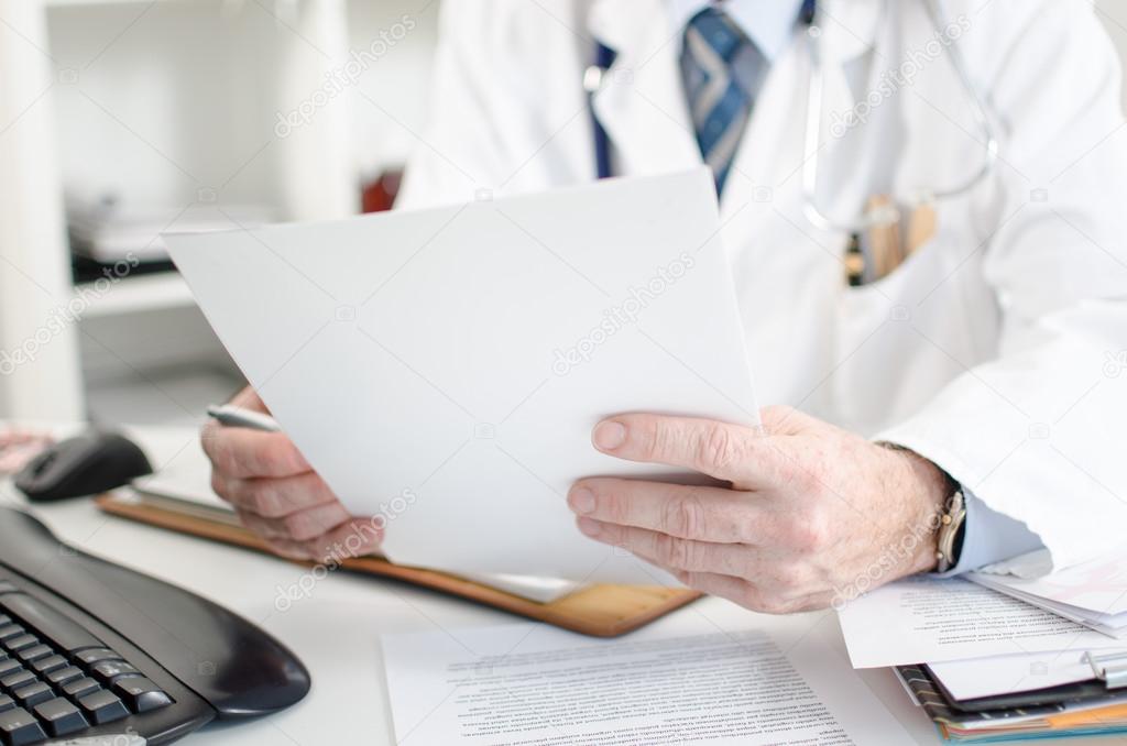 Doctor reading medical notes