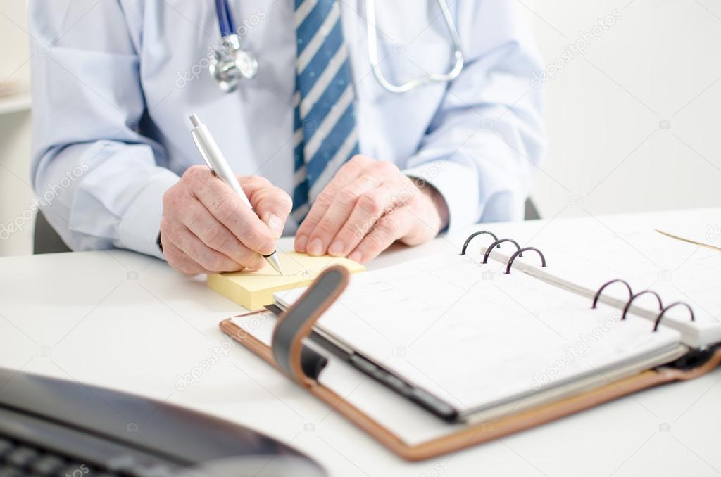 Doctor taking notes