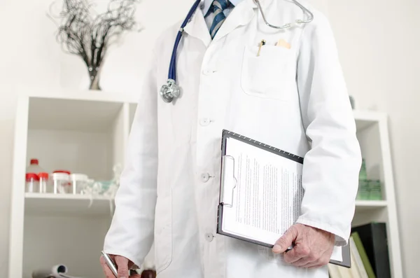 Doctor standing in his office — Stock Photo, Image