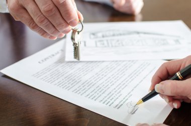 Woman signing a real estate contract clipart